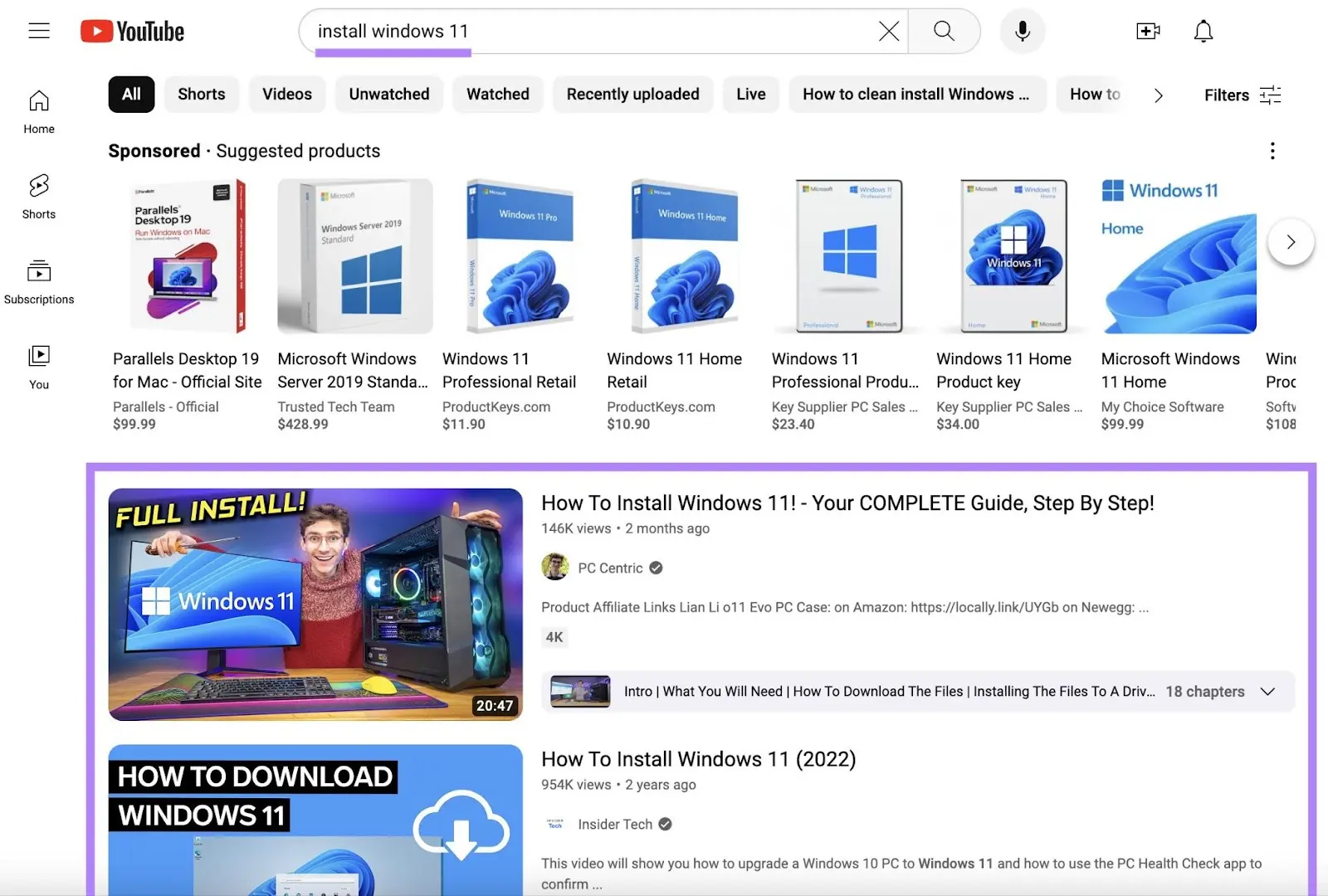 YouTube search results for 'install windows 11' showing sponsored product ads和organic results below them