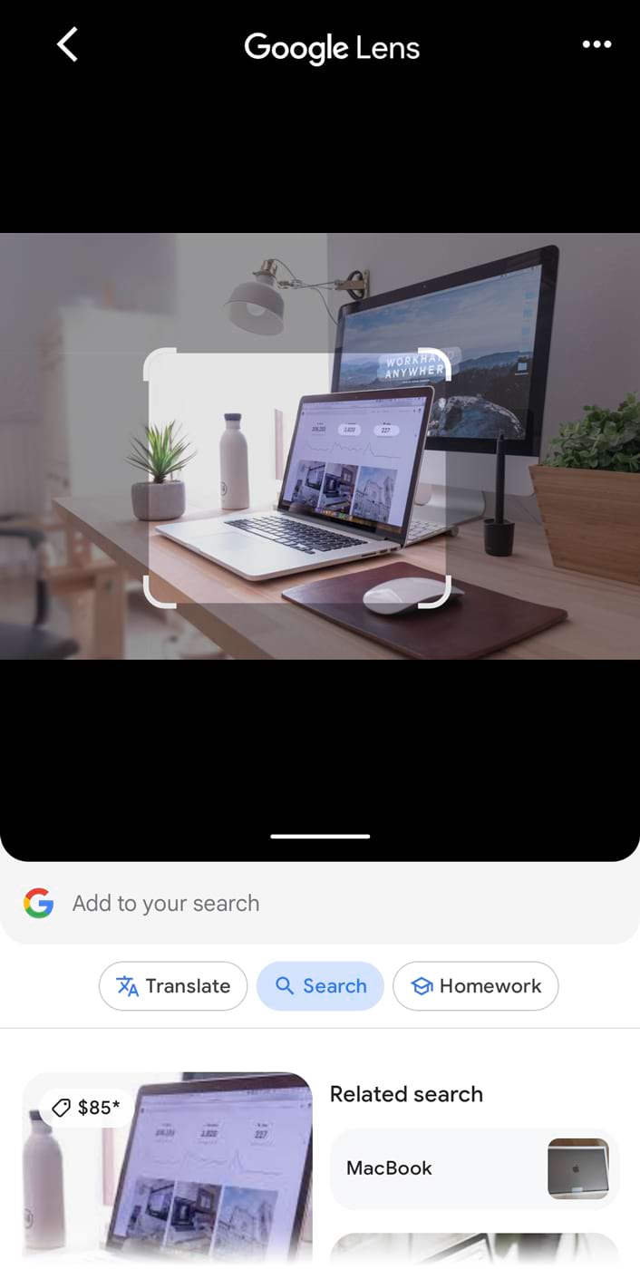 An image of a work desk with laptop uploaded to the 谷歌镜头, showing results for laptops below